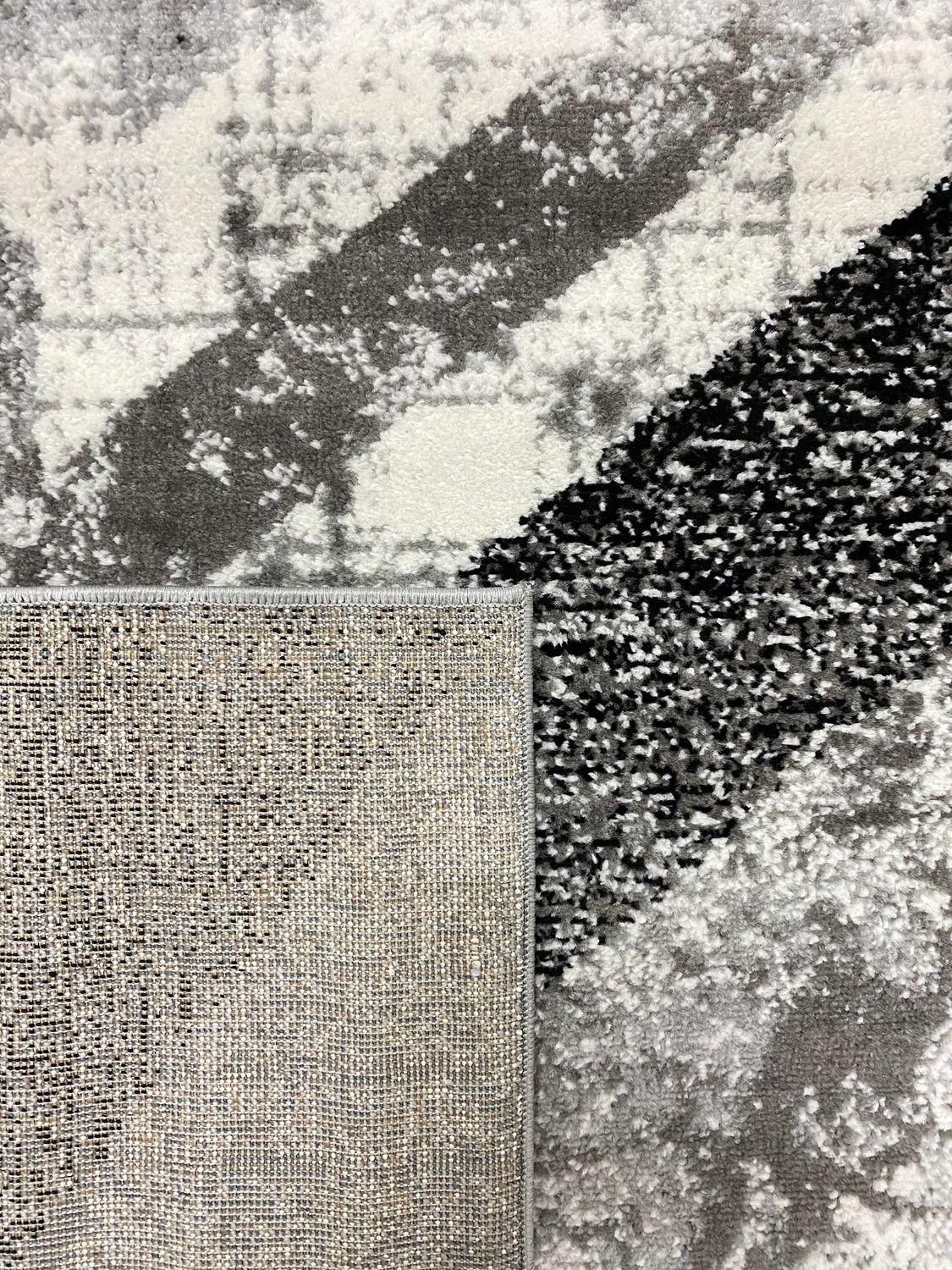 Designer rug for living room, geometric pattern, striped look, mottled red, grey, white, black