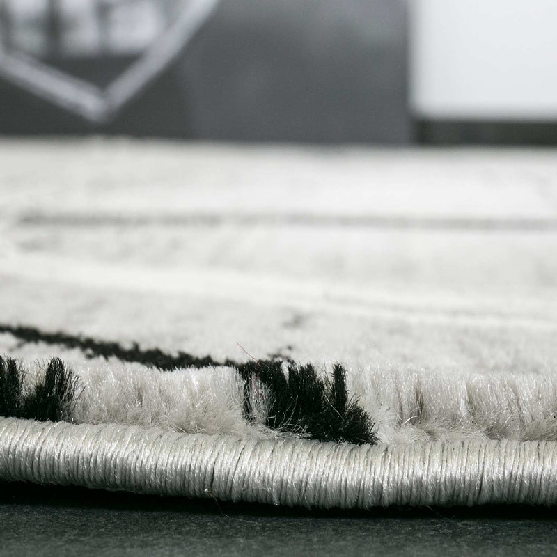 Designer rug, modern swirl pattern, mottled in grey and black-zoom-