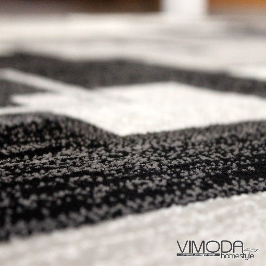 Designer living room rug, grey anthracite checkered retro with geometric motifs and color gradient