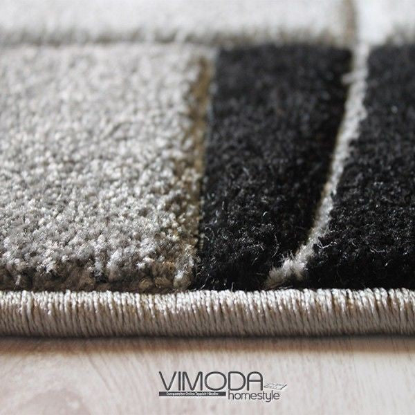 Teppich Modern Klassiker Kurzflor dicht gewebt mit Bordürenmotiv grau weiß schwarz und Konturenschnitt
