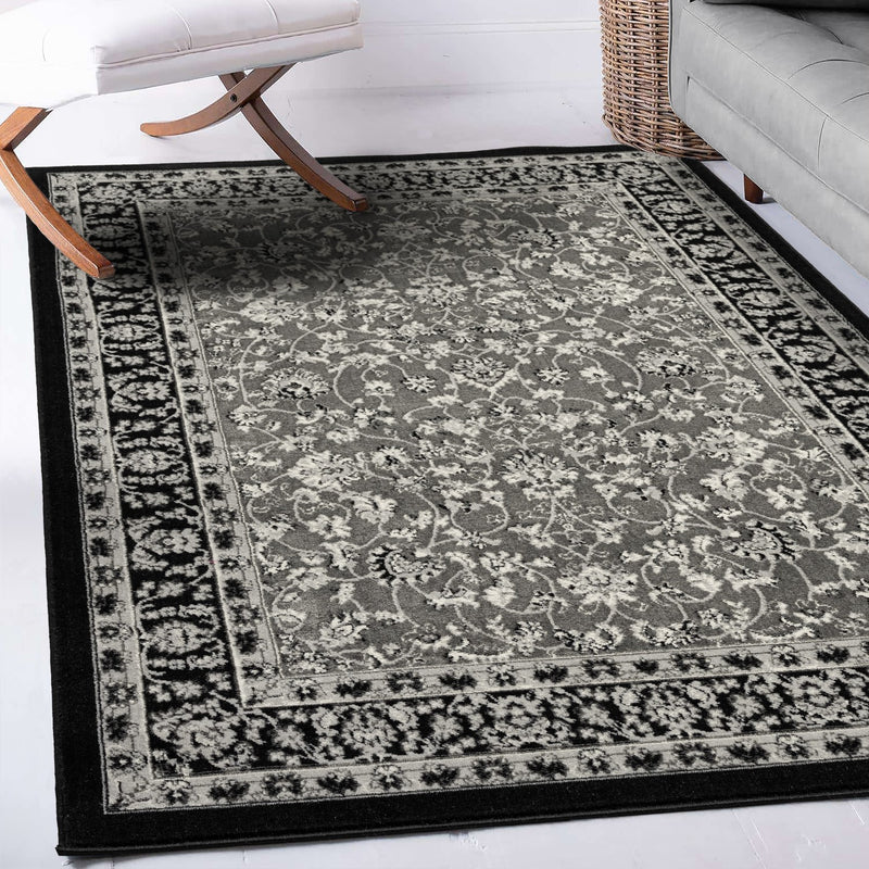 Oriental rug, grey and black, classically densely woven with ornament and floral motifs.-zoom-