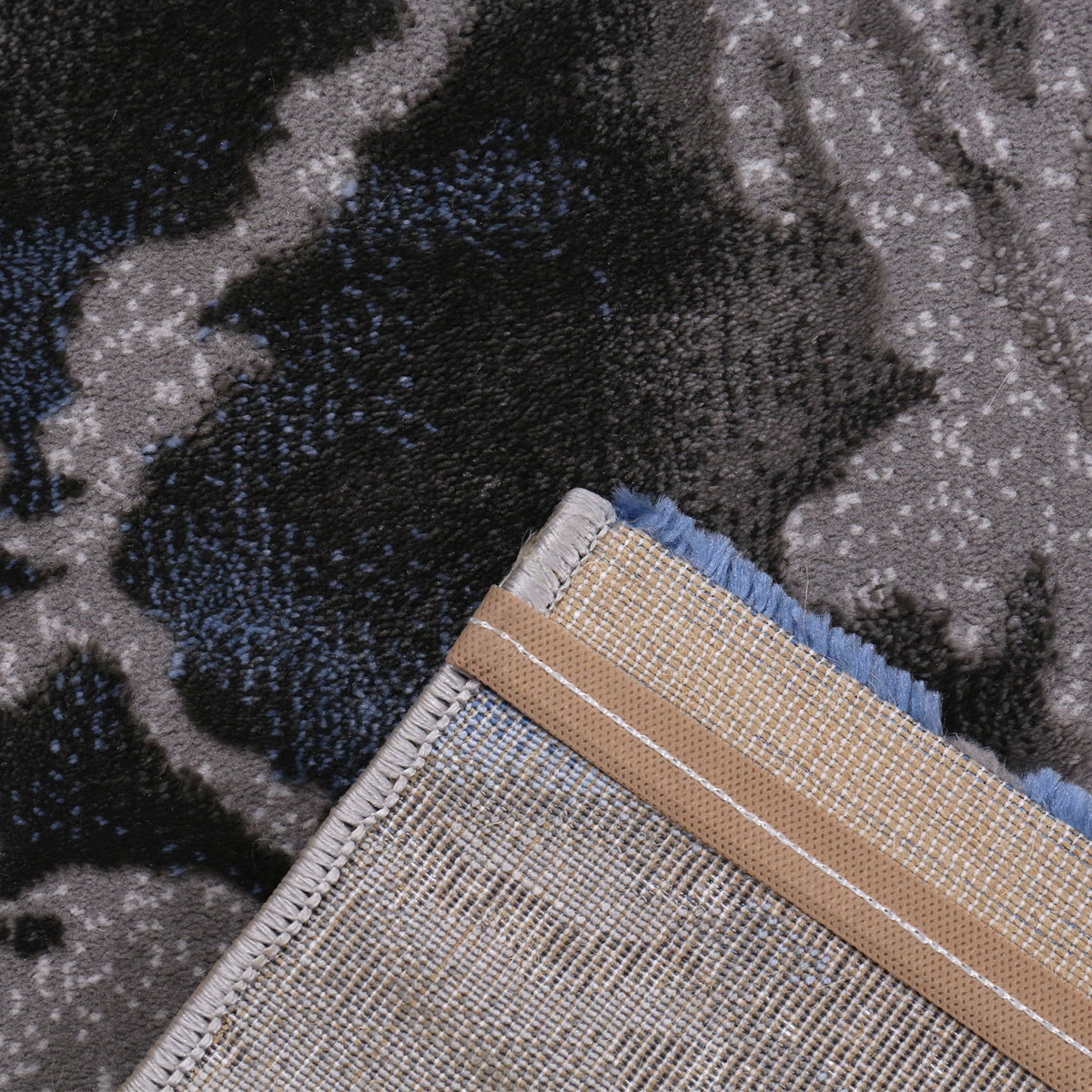 Abstract short-pile area rug in blue and grey with a distressed look, for living room, bedroom, kitchen