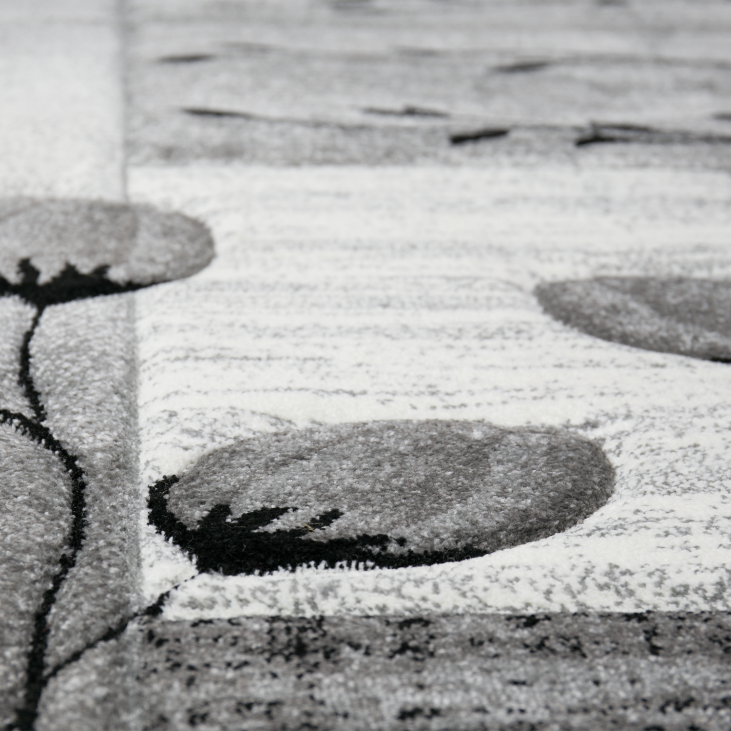 Designer rug, grey, black, cream, floral motif, mottled and contour cut by hand